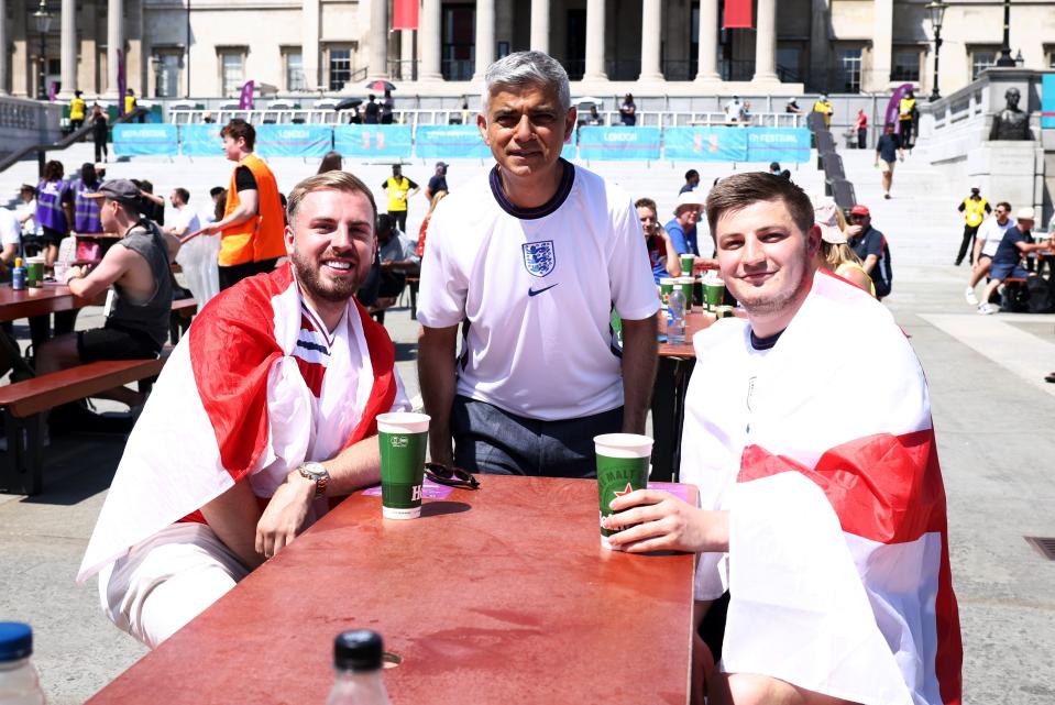 Sadiq Khan poses with fans (REUTERS)