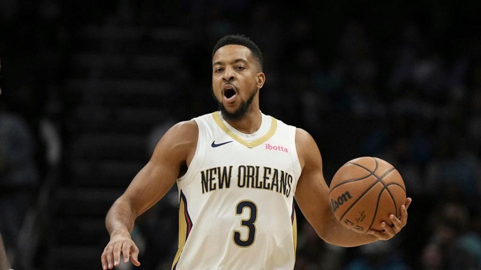 New Orleans Pelicans guard CJ McCollum brings the ball down court against the Charlotte Hornets during the first half Dec. 15 in Charlotte, N.C.