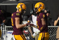 Arizona State running back Rachaad White (3) celebrates with wide receiver Ricky Pearsall after scoring a touch down agianst Arizona in the first half during an NCAA college football game, Saturday, Nov. 27, 2021, in Tempe, Ariz. (AP Photo/Rick Scuteri)