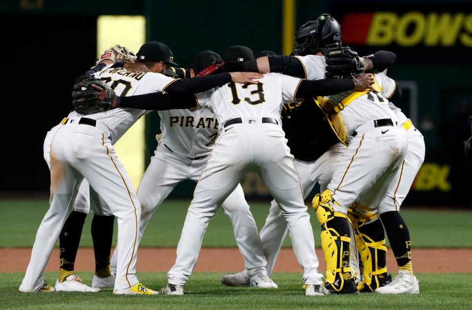 Pirates infielders and battery mates celebrate after defeating   the Reds at PNC Park.