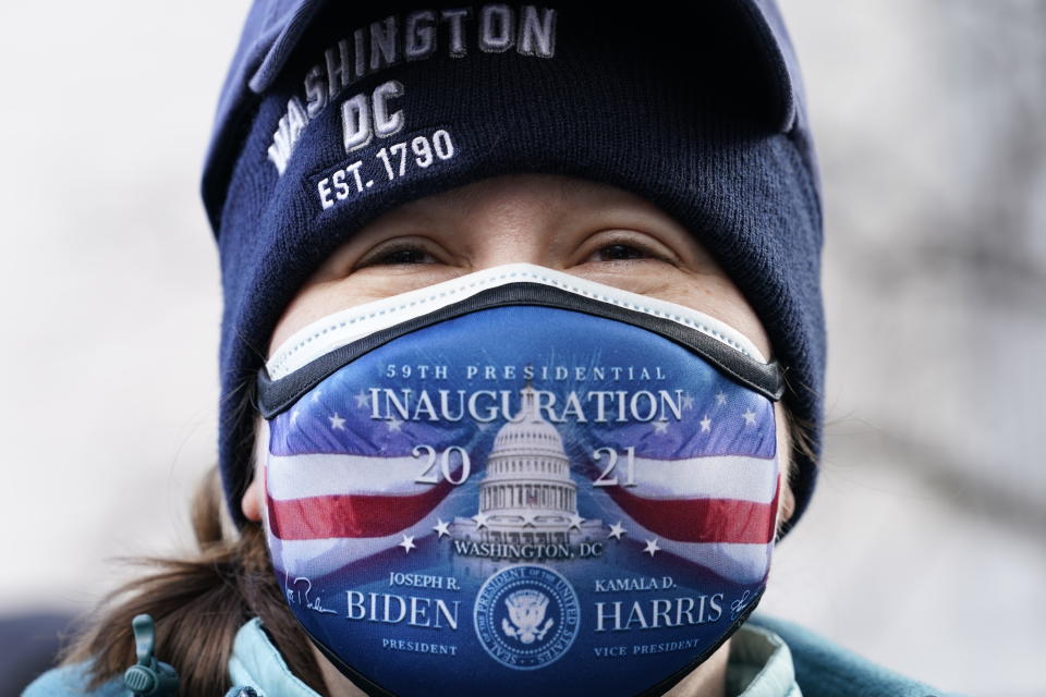 Dorothy Colegrove of Anchorage, Alaska, tries to see President-elect Joe Biden as he leaves an early morning church service, in Washington, Wednesday, Jan. 20, 2021. (AP Photo/Jacquelyn Martin)