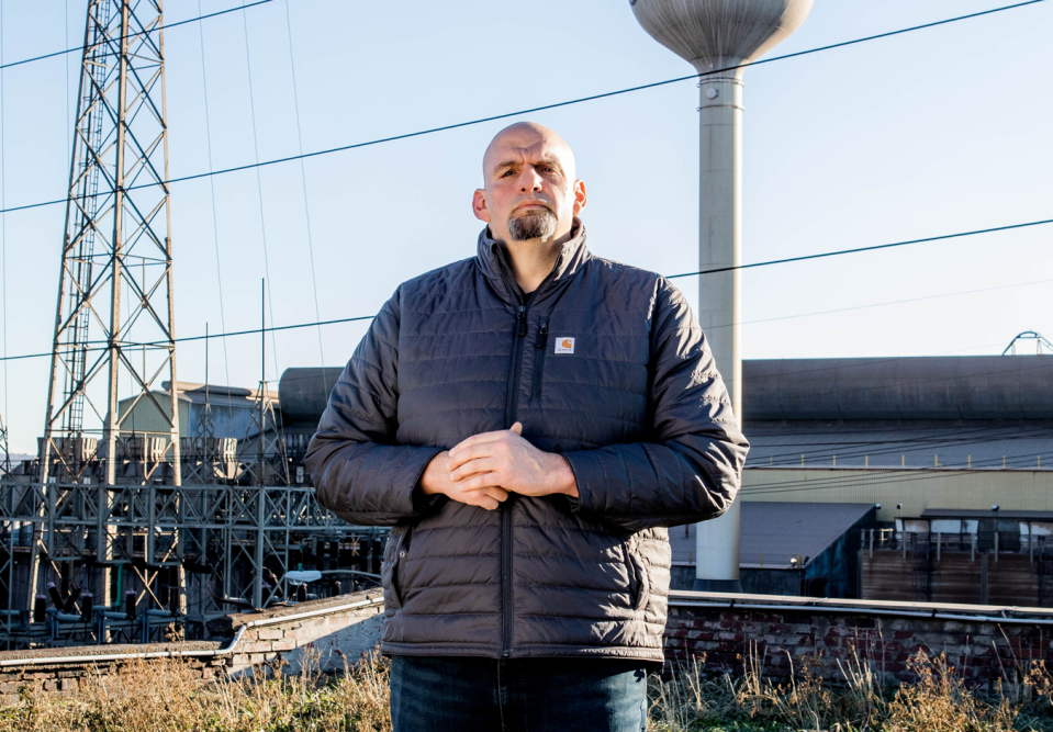 john fetterman wearing carhartt in front of factory