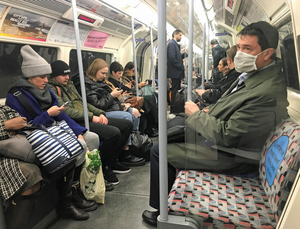 A man on the Jubilee line of the London Underground tube network wearing a protective facemask on the day that Heath Secretary Matt Hancock said that the number of people diagnosed with coronavirus in the UK has risen to 51.