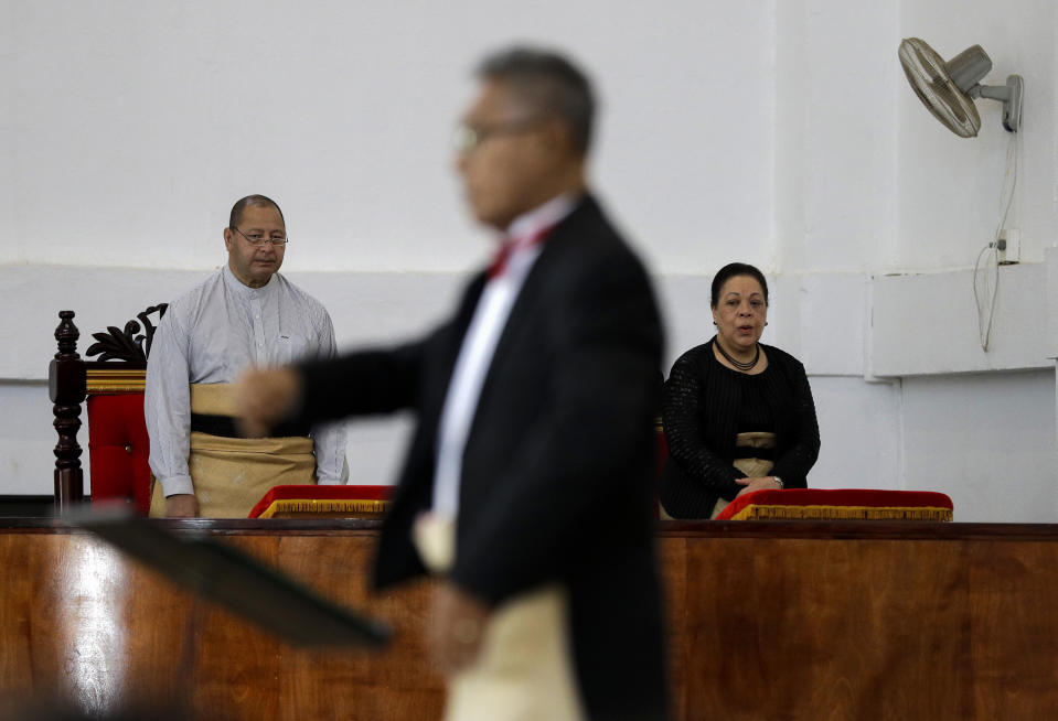 In this April 7, 2019, photo, Tonga King Tupou VI, left, and Queen Nanasipauʻu Tukuʻaho, right, attend a mass at the Free Wesleyan Church in Nuku'alofa, Tonga. China is pouring billions of dollars in aid and low-interest loans into the South Pacific, and even in the far-flung kingdom of Tonga there are signs that a battle for power and influence among much larger nations is heating up and could exact a toll. (AP Photo/Mark Baker)