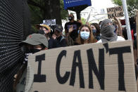 Demonstrators gather to protest the death of George Floyd, Tuesday, June 2, 2020, near the White House in Washington. Floyd died after being restrained by Minneapolis police officers. (AP Photo/Jacquelyn Martin)