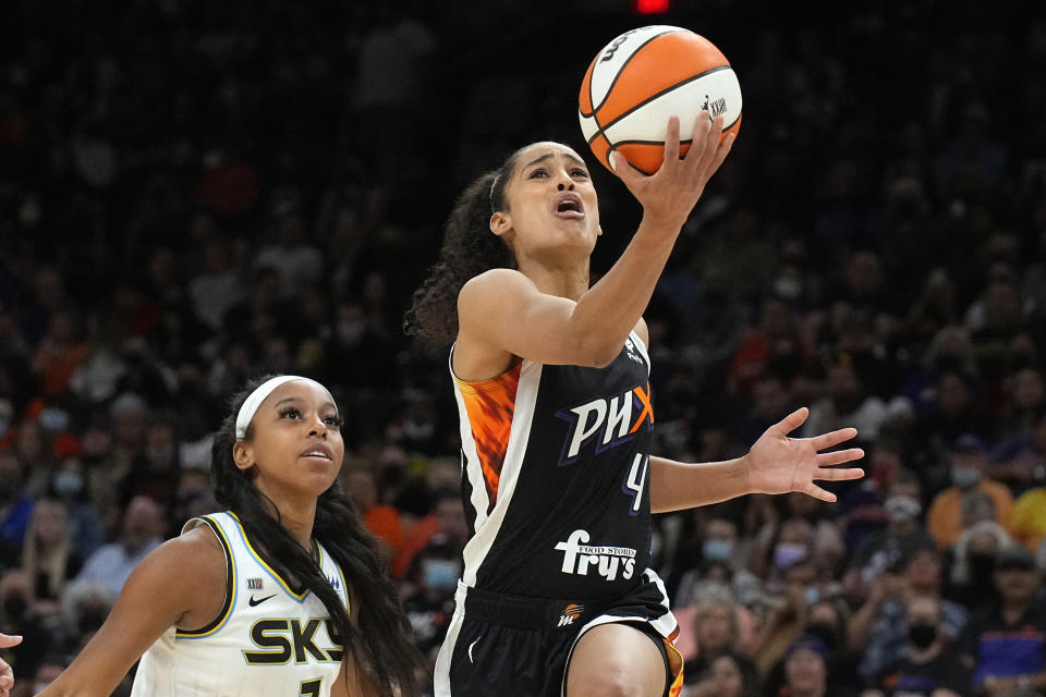 Phoenix Mercury guard Skylar Diggins-Smith (4) drives past Chicago Sky guard Lexie Brown during the first half of Game 2 of basketball's WNBA Finals, Wednesday, Oct. 13, 2021, in Phoenix. (AP Photo/Rick Scuteri)