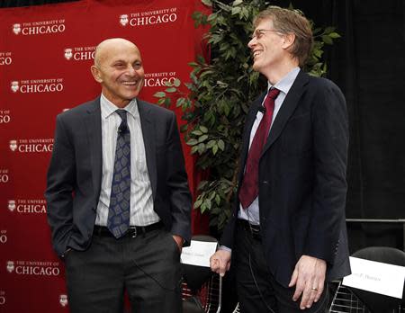 University of Chicago professors Eugene F. Fama (L) and Lars Hansen share a laugh at the end of a news conference after it was announced they won the 2013 Nobel Prize in Economics in Chicago, October 14, 2013. REUTERS/Jim Young