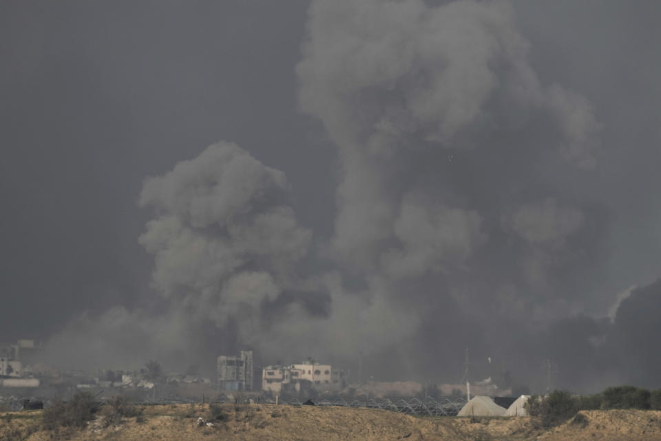 Smoke rises following an Israeli bombardment in the Gaza Strip, as seen from southern Israel , Tuesday, Dec. 19, 2023. (AP Photo/Leo Correa)