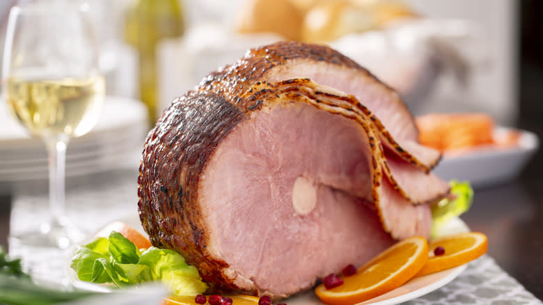 ham with slices on plate