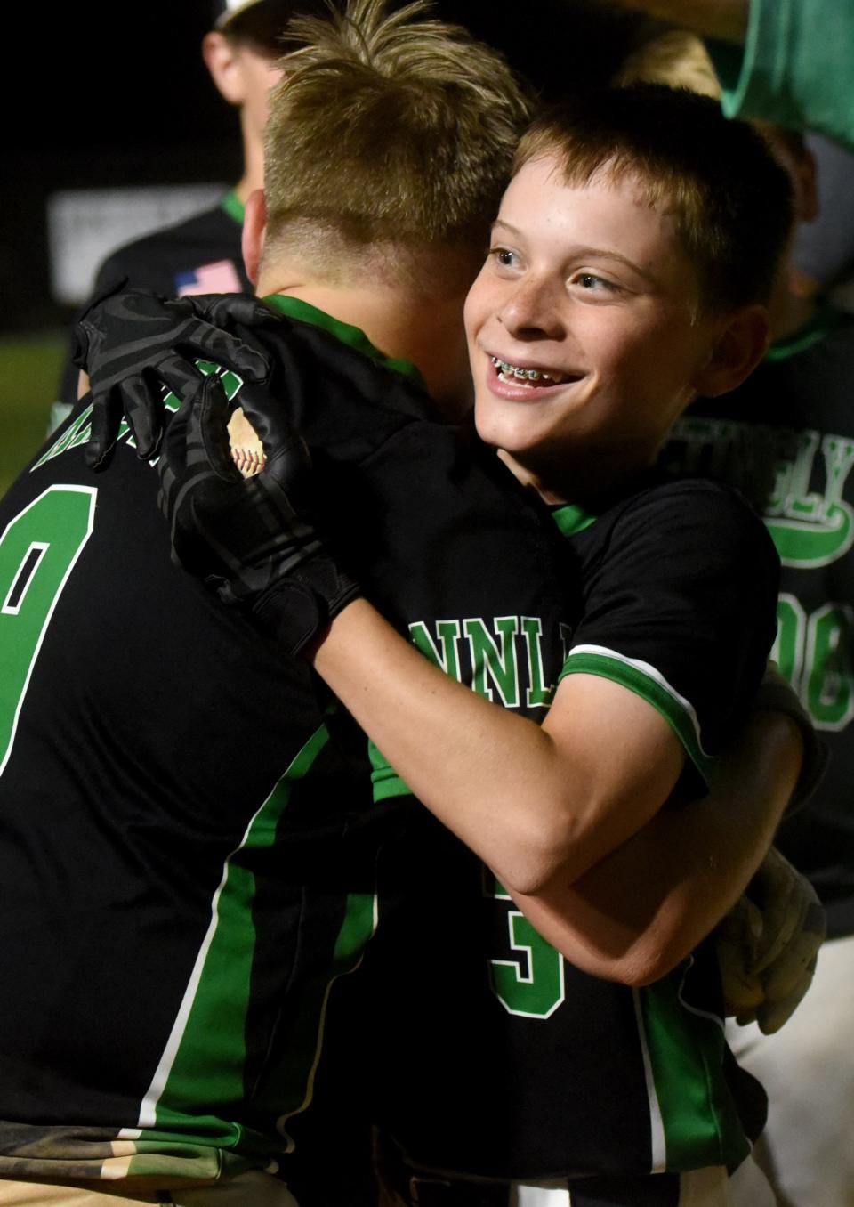 Mattingly Landscape players Joey Krupp (left) and Colin Fetherolf celebrate after winning the Varsity Division championship in the 77th Licking County Shrine Tournament.