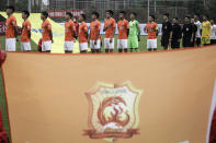 Members of Wuhan FC, then known as Wuhan Zall, prepare for an internal training match in Wuhan in central China's Hubei province on July 2, 2020. The club endured quite an ordeal last year after first being stranded in Spain on a preseason tour as its home city was overrun by the virus, and then fleeing the country just before the outbreak hit Europe hard. (Chinatopix via AP)