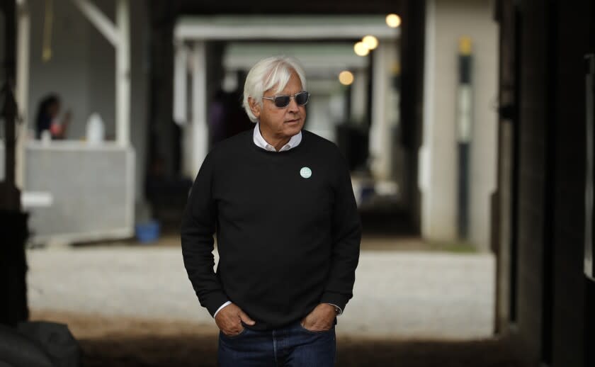 FILE - In this May 1, 2019, file photo, trainer Bob Baffert looks out from his barn before a workout at Churchill Downs in Louisville, Ky. Baffert was suspended for two years by Churchill Downs on Wednesday, Mune 2, 2021, after an additional drug test of Medina Spirit confirmed the presence of the steroid betamethasone in the Kentucky Derby winner's system. (AP Photo/Charlie Riedel, File)