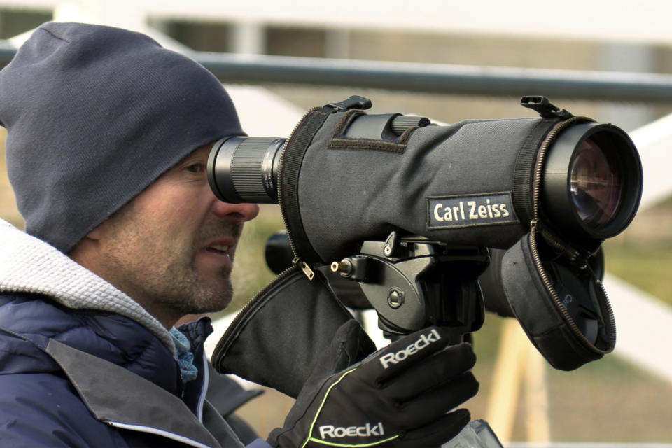 Armin Auchentaller looks through a scope during Biathlon World Cup Team Trials at Soldier Hollow on Oct. 24, 2021, in Midway, Utah. A biathlete skis several kilometers and arrives at the shooting range with a heart rate as high as 180 beats per minute. Next they shoot at five targets within 25 to 35 seconds. “Shooting with a high heart rate is really difficult,” said Auchentaller of Antholz, Italy who coaches the U.S. women’s biathlon team. (AP Photo/Rick Bowmer)