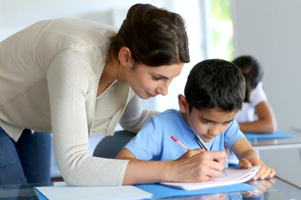   <span class="attribution"><a class="link " href="https://www.shutterstock.com/image-photo/teacher-helping-young-boy-writing-lesson-107801354" rel="nofollow noopener" target="_blank" data-ylk="slk:Shutterstock;elm:context_link;itc:0;sec:content-canvas">Shutterstock</a></span>