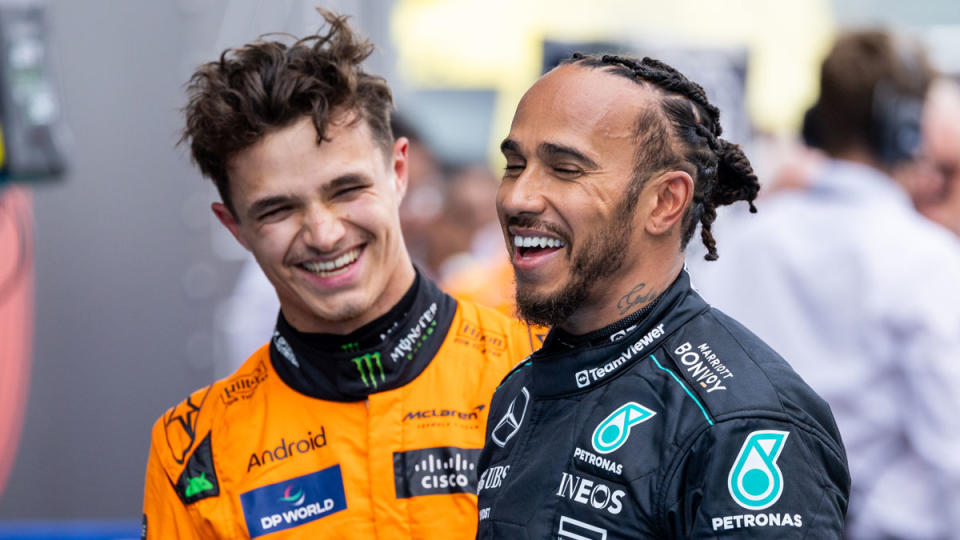 McLaren's Lando Norrisand Mercedes' Lewis Hamilton share a lighthearted moment after the qualifying rounds of Formula 1's 2024 Spanish Grand Prix.