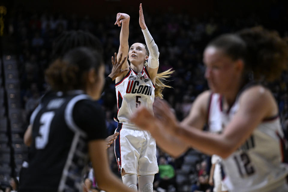 UConn guard Paige Bueckers (5) watches her shot during the first half of an NCAA college basketball game against Georgetown in the finals of the Big East Conference tournament at Mohegan Sun Arena, Monday, March 11, 2024, in Uncasville, Conn. (AP Photo/Jessica Hill)