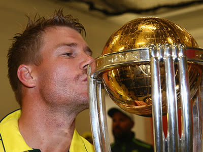 Warner plants one on the trophy.