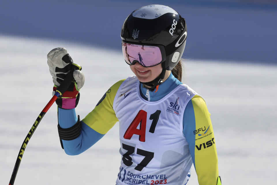 Ukraine's Anastasiia Shepilenko waves at the finish area of an alpine ski, women's World Championships super G, in Meribel, France, Wednesday, Feb. 8, 2023. (AP Photo/Marco Trovati)