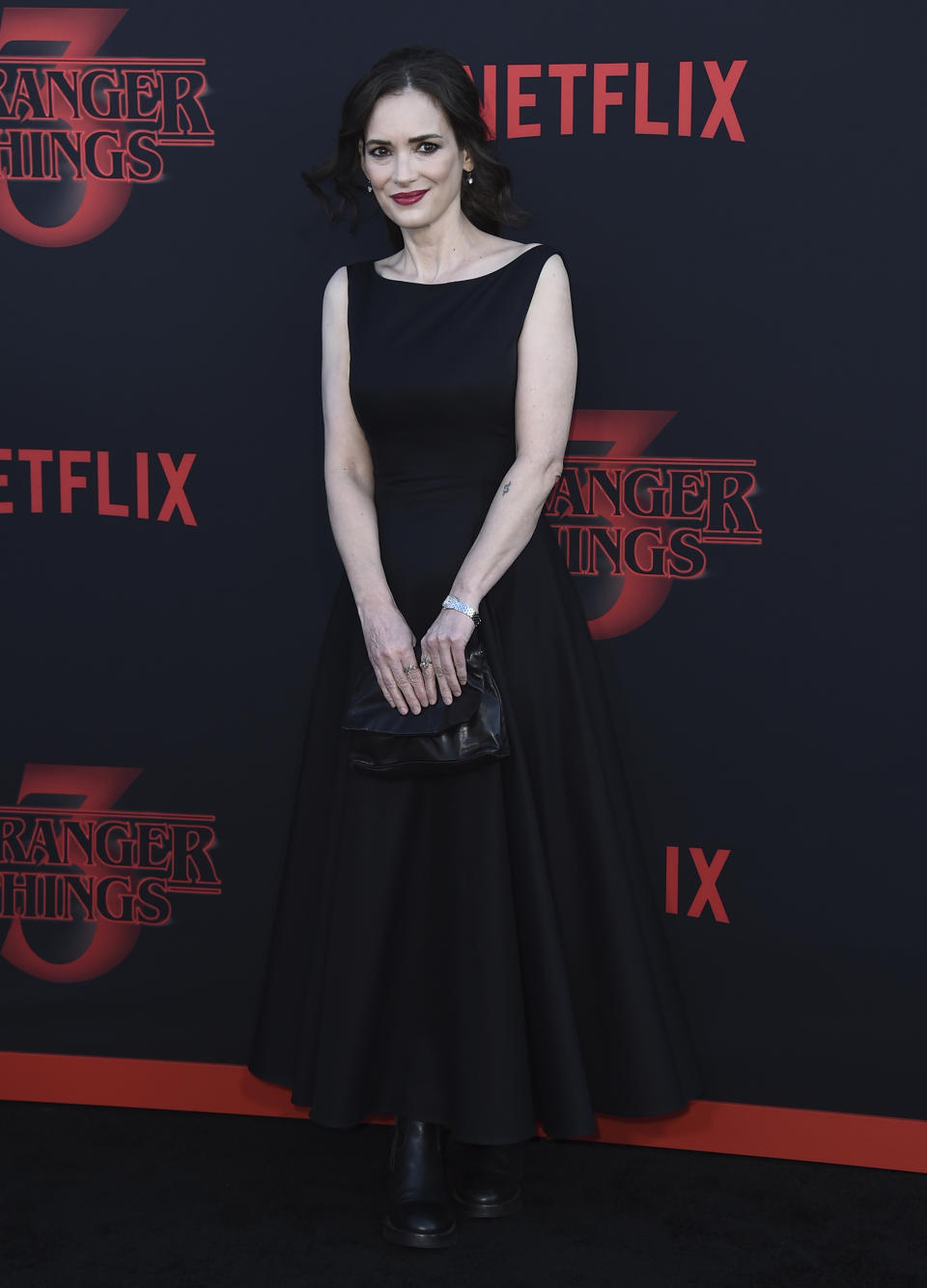 FILE - Winona Ryder arrives at the season three premiere of "Stranger Things" on June 28, 2019, in Santa Monica, Ryder turns 50 on Oct. 29. Calif. (Photo by Jordan Strauss/Invision/AP, File)