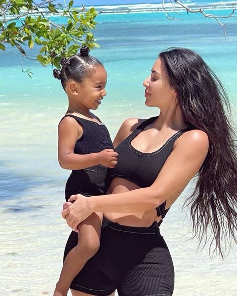 <p>"My twin forever," Kim Kardashian captioned a photo <a href="https://www.instagram.com/p/CNYIm0fAGyC/" rel="nofollow noopener" target="_blank" data-ylk="slk:matching with her daughter;elm:context_link;itc:0;sec:content-canvas" class="link ">matching with her daughter</a> Chicago in black swimsuits. </p>