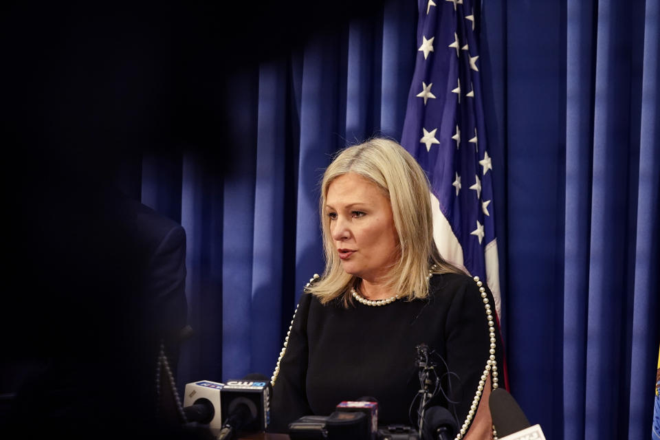 Oakland County prosecutor Karen McDonald addresses the media in her office, Friday, Dec. 3, 2021, in Pontiac, Mich. McDonald filed involuntary manslaughter charges against Jennifer and James Crumbley, the parents of 15-year-old Ethan Crumbley, who is accused of killing four students at a Michigan high school. McDonald says the gun used in the shootings at Oxford High School was purchased by James Crumbley a week ago and given to the boy. (AP Photo/Carlos Osorio)