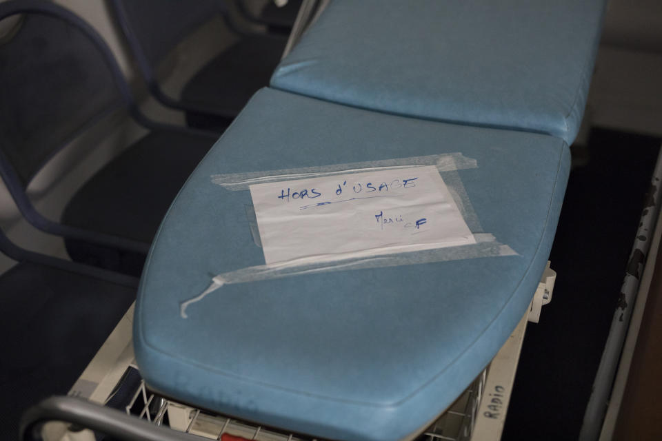 In this photo taken on Dec.19, 2019 a sign reads "out of service, thank you" on a gurney in Marseille's Hospital de la Conception, southern France. In a hospital in Marseille, student doctors are holding an exceptional, open-ended strike to demand a better future. France’s vaunted public hospital system is increasingly stretched to its limits after years of cost cuts, and the interns at La Timone - one of the country’s biggest hospitals - say their internships are failing to prepare them as medical professionals. Instead, the doctors-in-training are being used to fill the gaps. (AP Photo/ Daniel Cole)