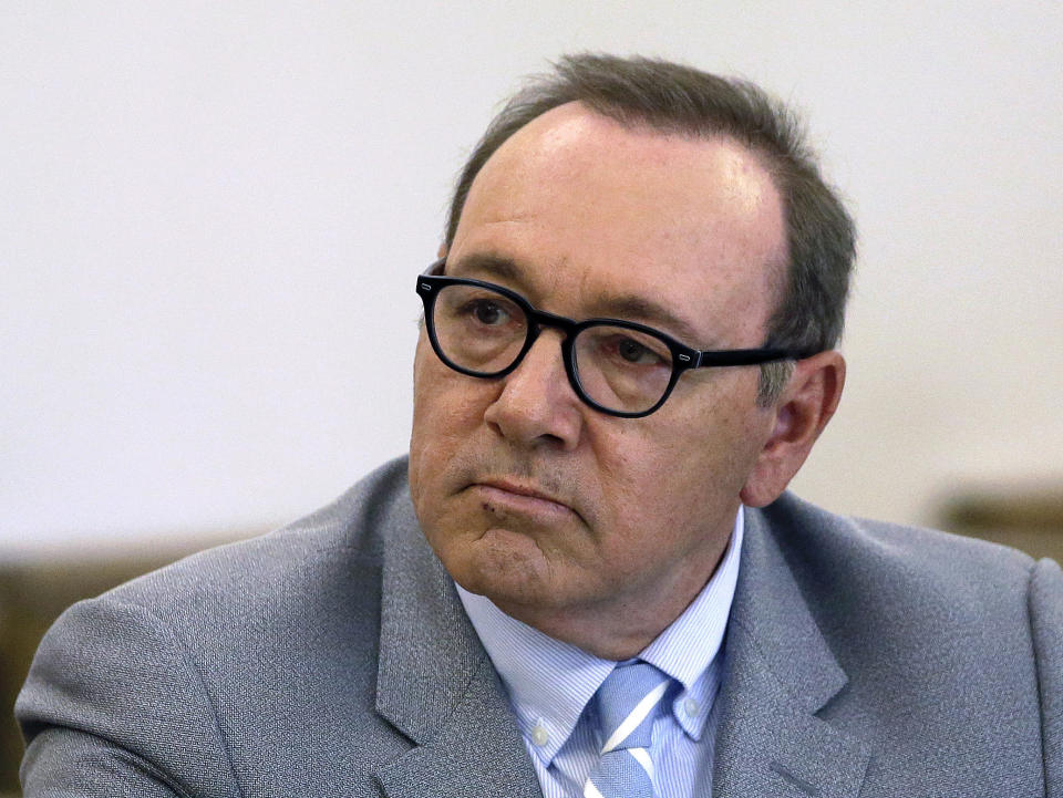 FILE - Kevin Spacey attends a pretrial hearing at district court in Nantucket, Mass, June 3, 2019. British prosecutors have charged actor Kevin Spacey with four counts of sexual assault against three men. The Crown Prosecution Service said Thursday, May 26, 2022 that Spacey “has also been charged with causing a person to engage in penetrative sexual activity without consent.” (AP Photo/Steven Senne, File)