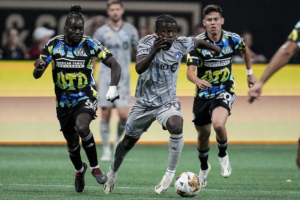 CF Montréal midfielder Kwadwo Opoku (90) moves the ball against Atlanta United during the second half of a MLS soccer match, Saturday, Sept. 23, 2023, in Atlanta. Atlanta United won 4-1. (AP Photo/Mike Stewart)