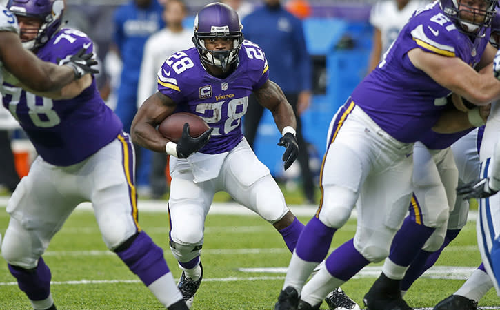 Dec 18, 2016; Minneapolis, MN, USA; Minnesota Vikings running back Adrian Peterson (28) rushes against the Indianapolis Colts before fumbling in the second quarter at U.S. Bank Stadium. Mandatory Credit: Bruce Kluckhohn-USA TODAY Sports