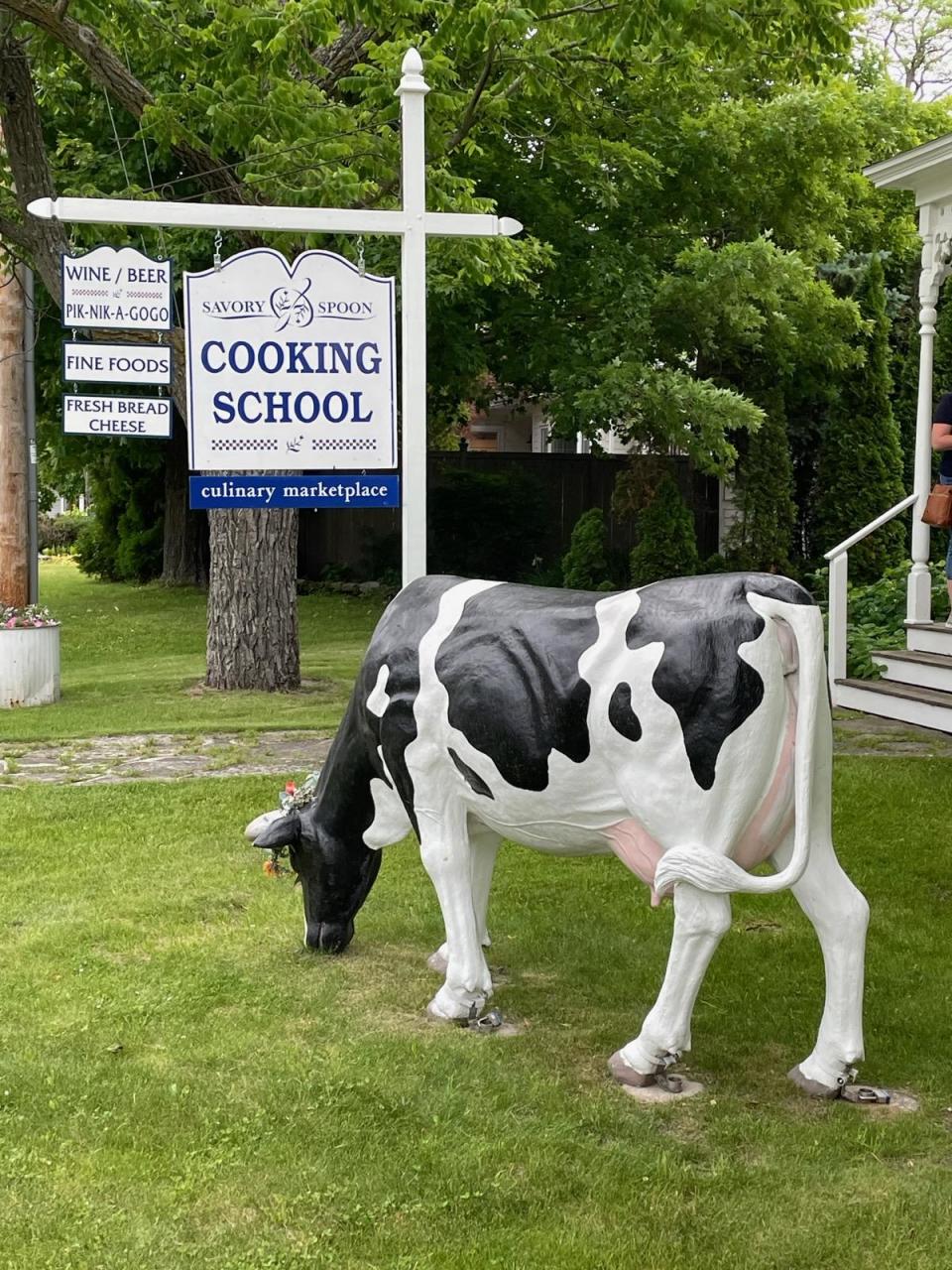 The Savory Spoon Cooking School sign has a Wisconsin flair.