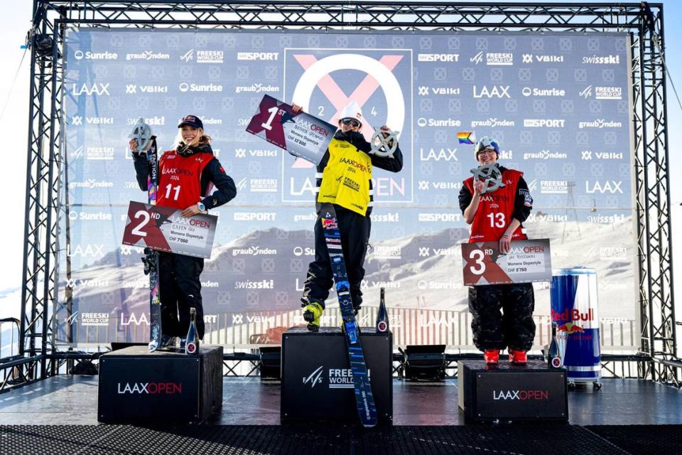 Riccomini (right) podiums at the FIS Freestyle Ski World Cup in January, an LGBTQ pride flag tucked into his beanie.