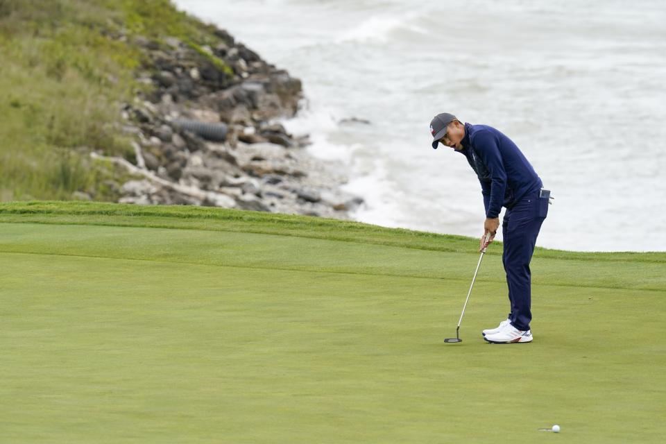 Team USA's Collin Morikawa reacts to his putt on the third hole during a practice day at the Ryder Cup at the Whistling Straits Golf Course Tuesday, Sept. 21, 2021, in Sheboygan, Wis. (AP Photo/Ashley Landis)