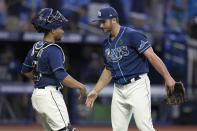 Tampa Bay Rays relief pitcher Colin Poche, right, celebrates with catcher Francisco Mejia after closing out the Miami Marlins during a baseball game Wednesday, May 25, 2022, in St. Petersburg, Fla. (AP Photo/Chris O'Meara)