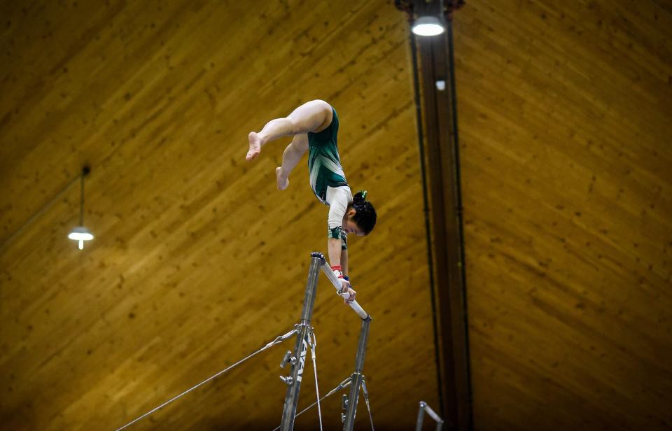 Hilltopper Lydia Ruggles competes on bars during the Vermont high school gymnastics state championship at St. Johnsbury Academy on Saturday, Feb. 17, 2024.