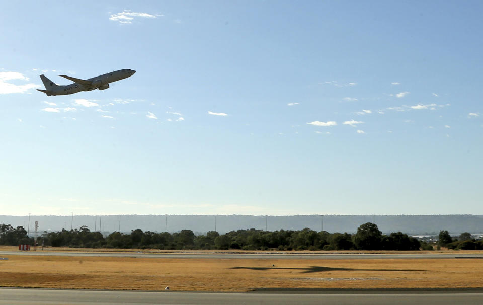 A U.S. Navy P8 Poseidon takes off from Perth Airport en route to rejoin the ongoing search operations for missing Malaysia Airlines Flight 370 in Perth, Australia, Sunday, April 13, 2014. Military planes and ships from seven nations continue to scour the Indian Ocean off the coast of western Australia for Flight 370 in one of the largest maritime multi-nation searches in history. (AP Photo/Rob Griffith)