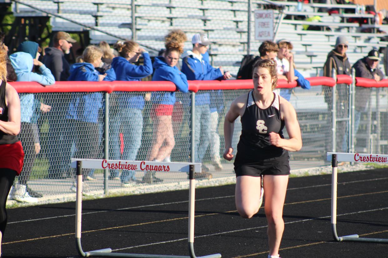 South Central's Grace Lamoreaux won the 100 hurdles. Here she runs in the 300 hurdles where she finished second place.