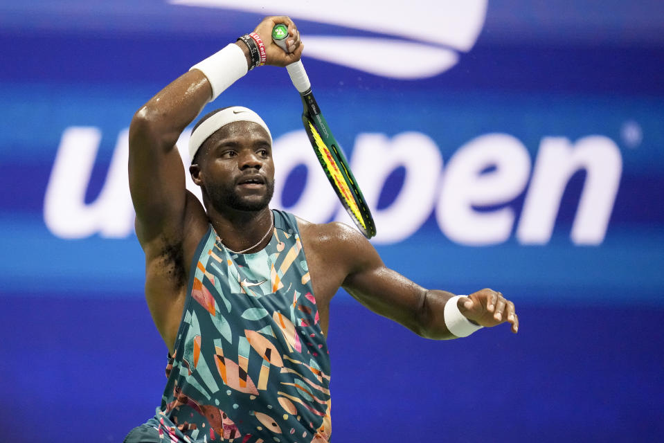 Frances Tiafoe, of the United States, returns a shot to Ben Shelton, of the United States, during the quarterfinals of the U.S. Open tennis championships, Tuesday, Sept. 5, 2023, in New York. (AP Photo/Charles Krupa)