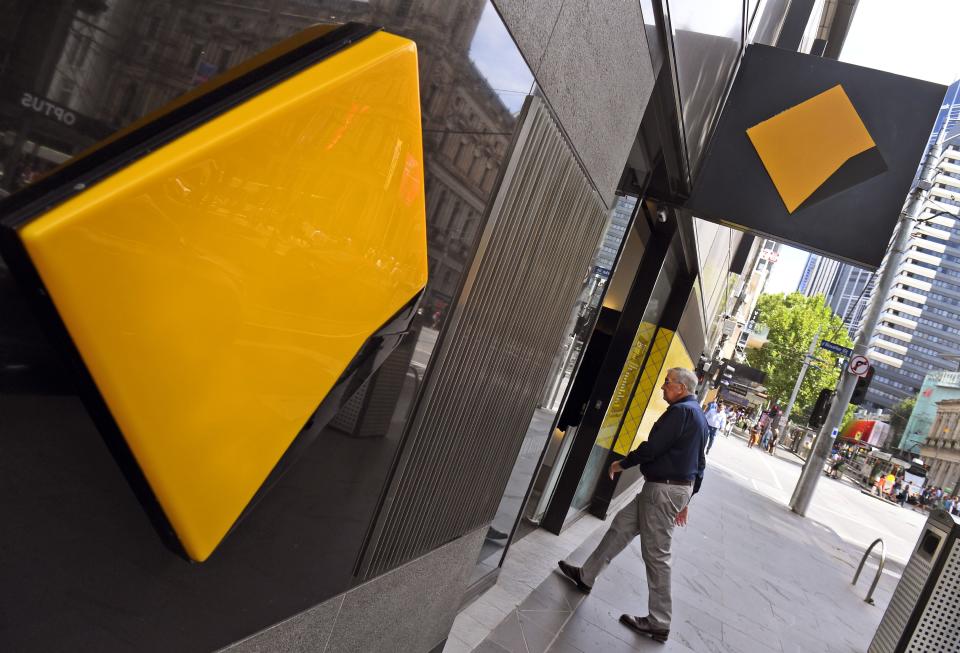 A man walks into a branch of the Commonwealth Bank in Melbourne on February 6, 2019. - Australia's largest financial firm Commonwealth Bank on February 6 said profits fell six percent in the last six months of 2018 amid a "challenging environment" for the business. (Photo by William WEST / AFP)        (Photo credit should read WILLIAM WEST/AFP via Getty Images)