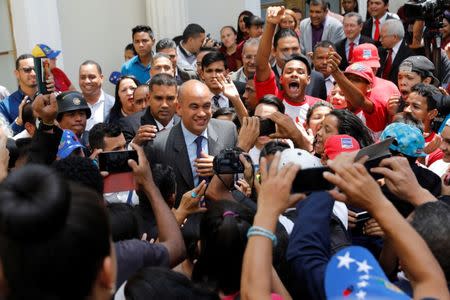 Hector Rodriguez (C), newly elected governor of Miranda state, arrives for a ceremony at the National Constituent Assembly at Palacio Federal Legislativo, in Caracas, Venezuela October 18, 2017. REUTERS/Marco Bello