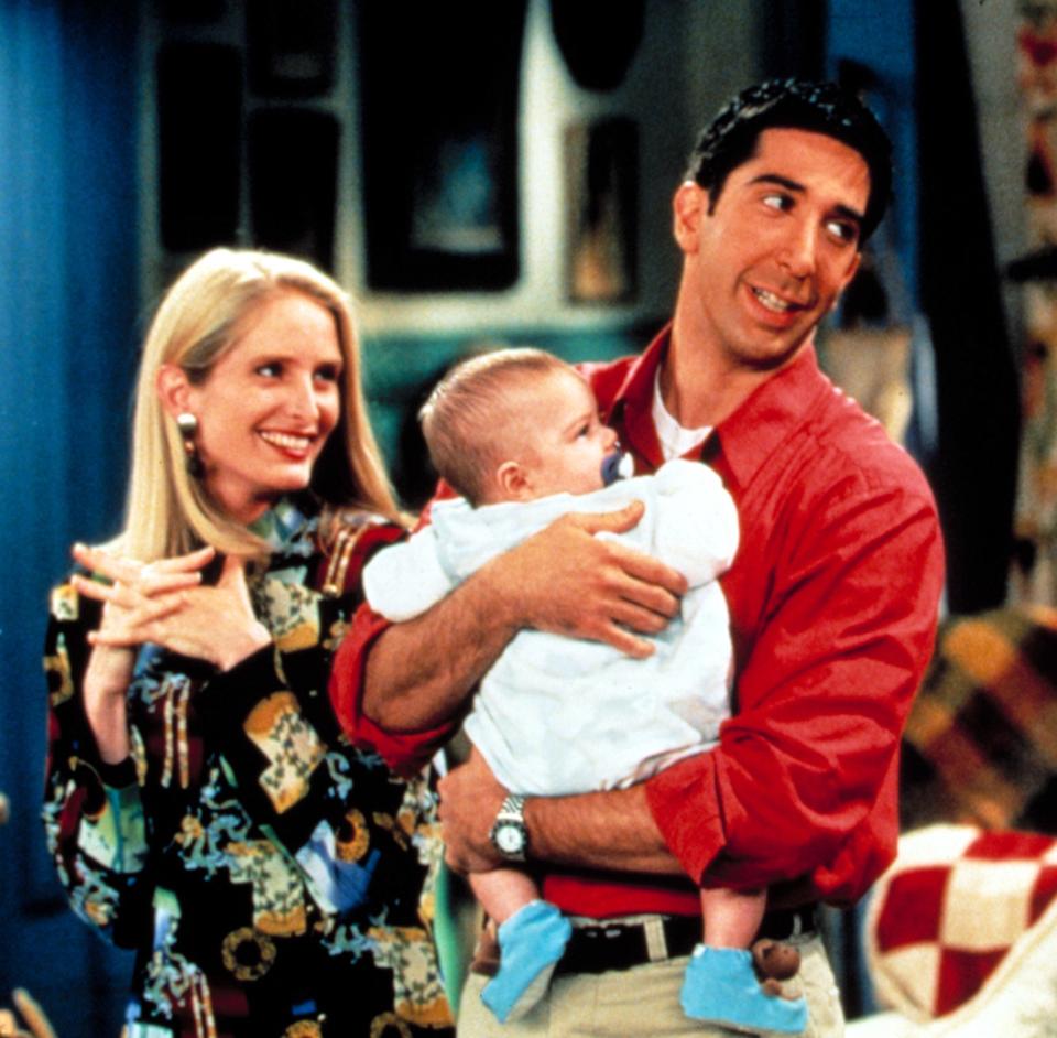 her beside ross as he holds their baby