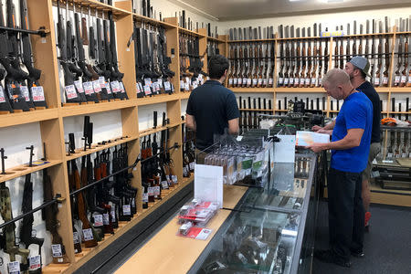 FILE PHOTO: Firearms and accessories are seen on display at Gun City gunshop in Christchurch, New Zealand, March 19, 2019. REUTERS/Jorge Silva/Files