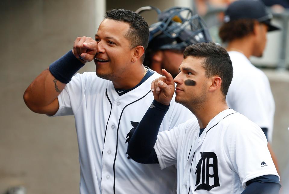 Detroit Tigers' Miguel Cabrera, left, and Jose Iglesias joke with a teammate before a baseball game against the Seattle Mariners in Detroit, Wednesday, June 22, 2016. (AP Photo/Paul Sancya)