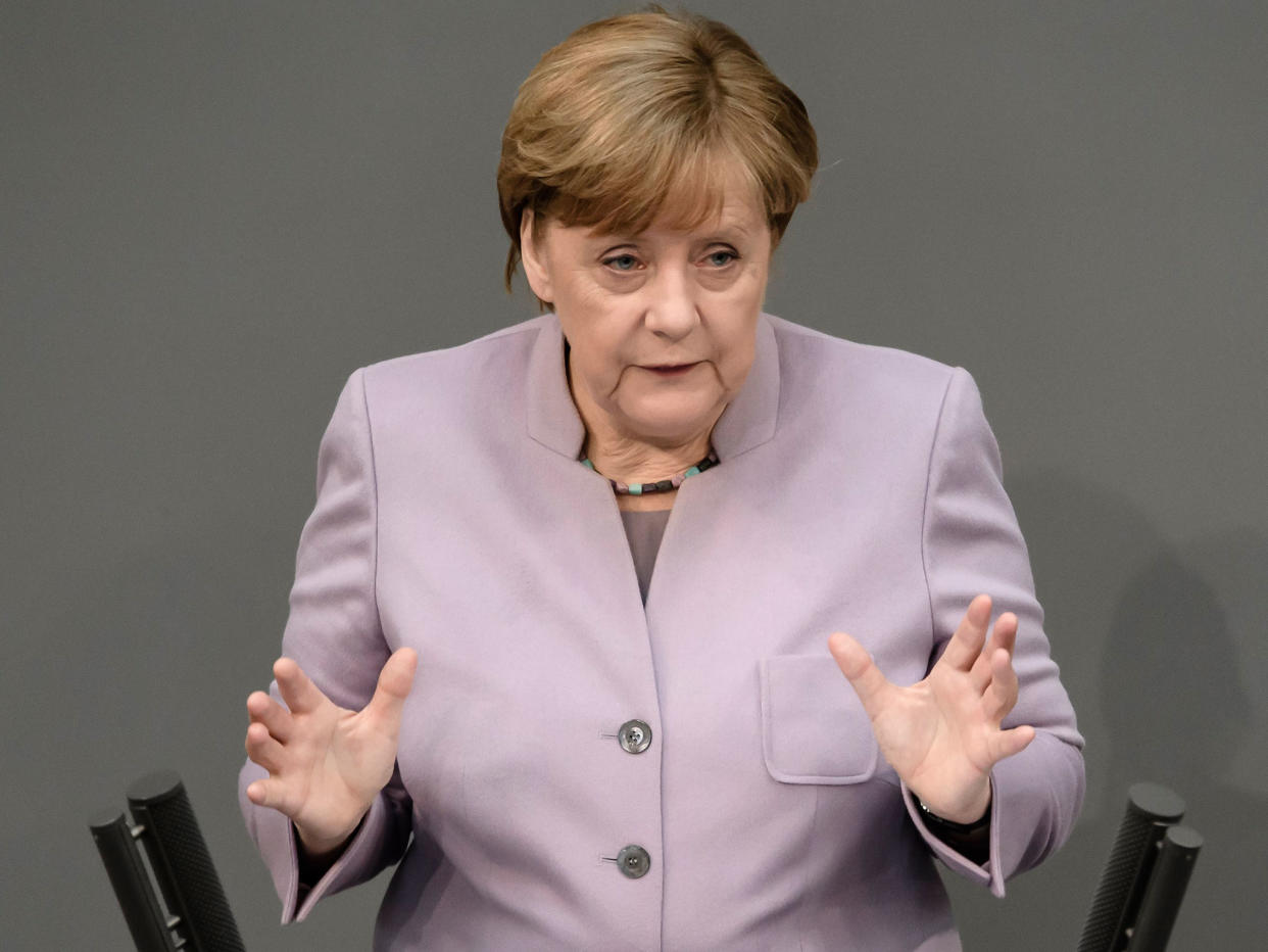 Angela Merkel addressing the Bundestag in Berlin on 27 April: EPA