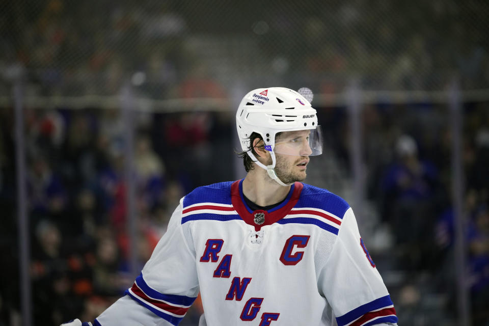 FILE - New York Rangers' Jacob Trouba plays during an NHL hockey game, Friday, Nov. 24, 2023, in Philadelphia. Jacob Trouba is far more than a hockey player. In fact, the New York Rangers captain might be the most interesting man in the NHL. Trouba asked for a trade to the U.S. to make sure his then-fiancée could pursue her medical career, was the first and only player to agree to have his photo taken getting the COVID-19 vaccine, paints artwork on the side and met with Fortune 500 CEOs about leadership before he got the ‘C.' (AP Photo/Matt Slocum, File)