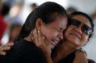 A woman is seen crying after receiving information that her brother was one of the inmates who died during a prison riot, in front of the Medical Legal Institute in Manaus, Brazil, January 3, 2017. REUTERS/Ueslei Marcelino