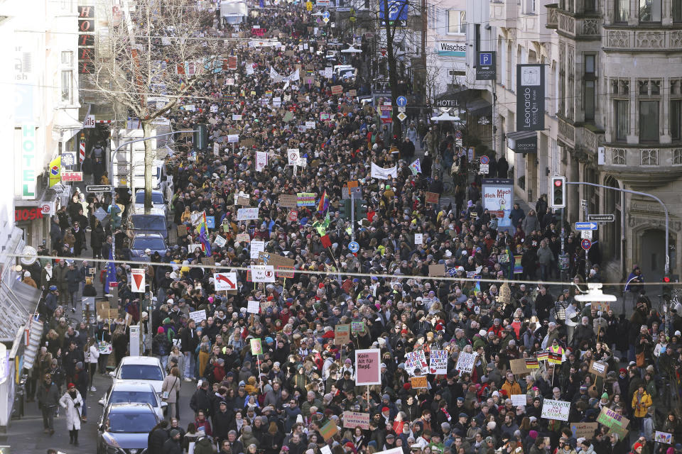 People gather in Duesseldorf, Germany, Saturday Jan. 27, 2024, to protest against right-wing extremist activities. (David Young/dpa via AP)