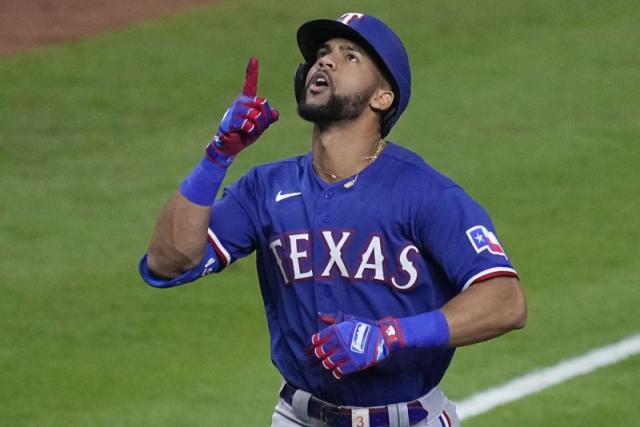 Texas Rangers center fielder Leody Taveras watches the pitch from