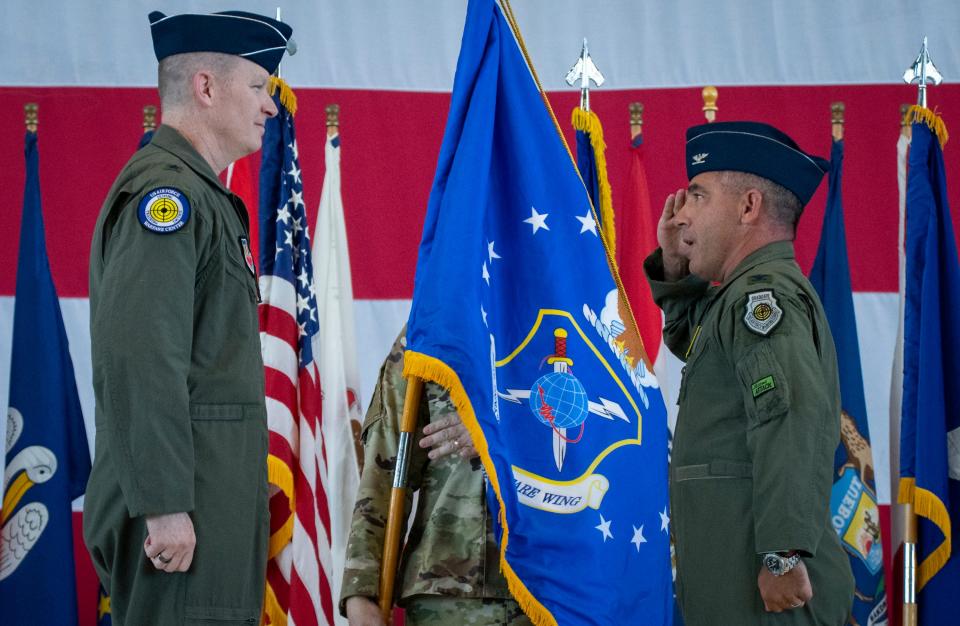 Col. Joshua Koslov salutes before taking command of the 350th Spectrum Warfare Wing during a change-of-command ceremony July 28 at Eglin Air Force Base. Koslov took over for Col. William Young.
