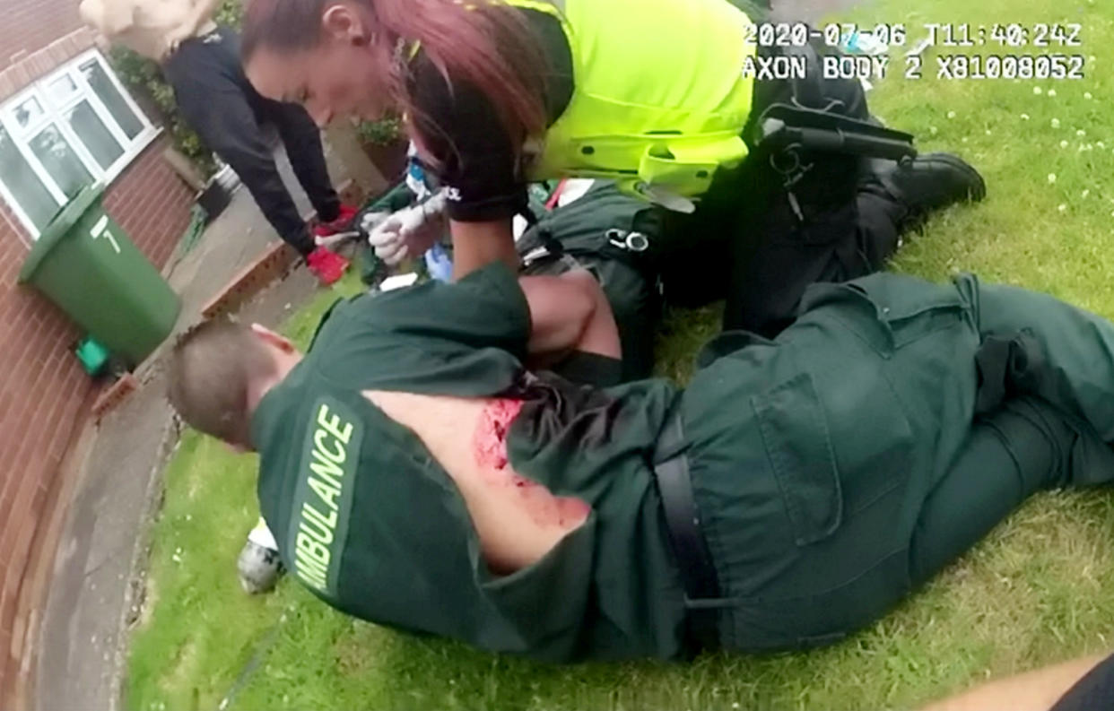 Bodycam still of Mick Hipgrave and Deena Evans.  Two paramedics, who were stabbed whilst on duty last year, hope the attacker’s sentence sends a strong message of the consequences of assaulting emergency service workers.  See SWNS story SWMDstab.  52-year-old Martyn Smith has today been sentenced to nine years in prison after pleading guilty to two counts of wounding with intent to cause grievous bodily harm to the pair after they were called out to his home in Wolverhampton last summer.  Shocking police bodycam footage shows the moment Mick Hipgrave and Deena Evans were attacked by Smith with two large kitchen knives as they carried out a welfare check in Stephens Close, on 6th July 2020.  Deena suffered a punctured lung in the attack and subsequently spent three days in hospital following surgery. Mick was stabbed in the back and was discharged from hospital the same day. The pair spent months off work for both their physical and mental recovery. However, the mental scars are still very much there.  The whole incident lasted about 12 seconds, from the moment Mick and Deena entered the property, to Smith being tasered. However, the devastating impact of those 12 seconds will stay with our paramedics forever.  