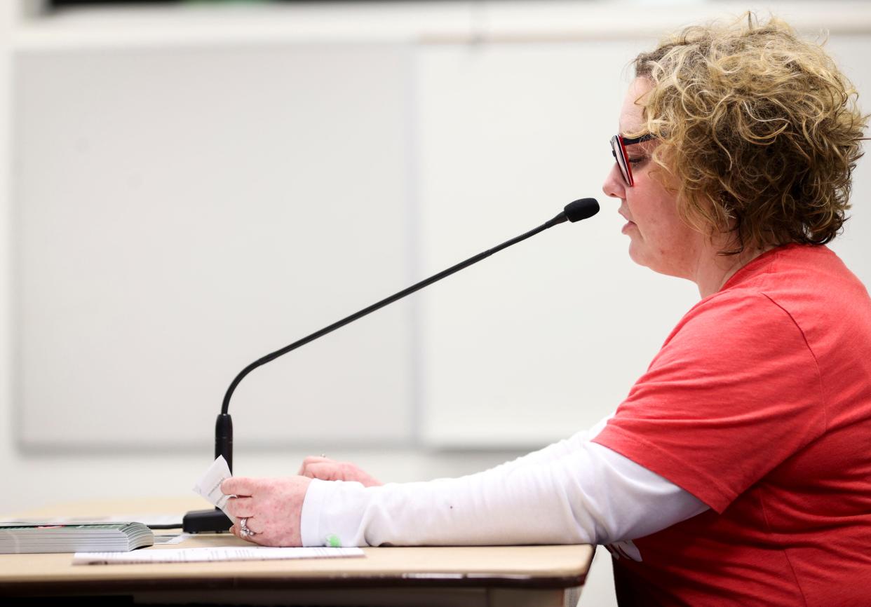 Carrie Litchfield, a teacher in the district’s teen parent program, raises concerns about the proposed budget cuts and how those cuts will affect nurse staffing in schools.